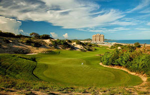 green surrounded by sand dunes, the bluffs ho tram, ho chi minh, vietnam